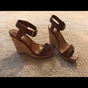 Calvin Klein wedges with gold buckle.